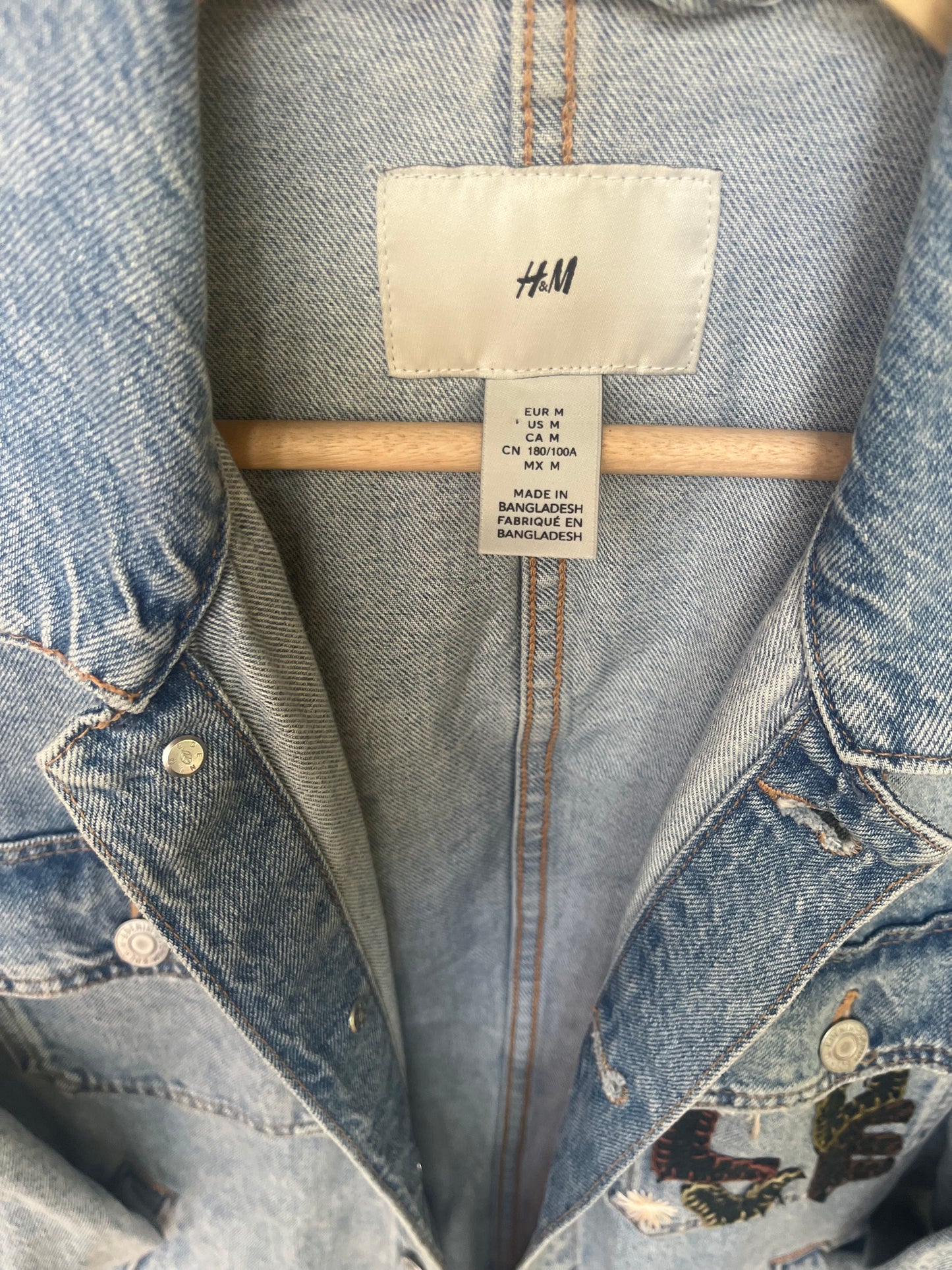 L O V E denim jacket with wool heart sleeves SIZE small (assuming men’s small)