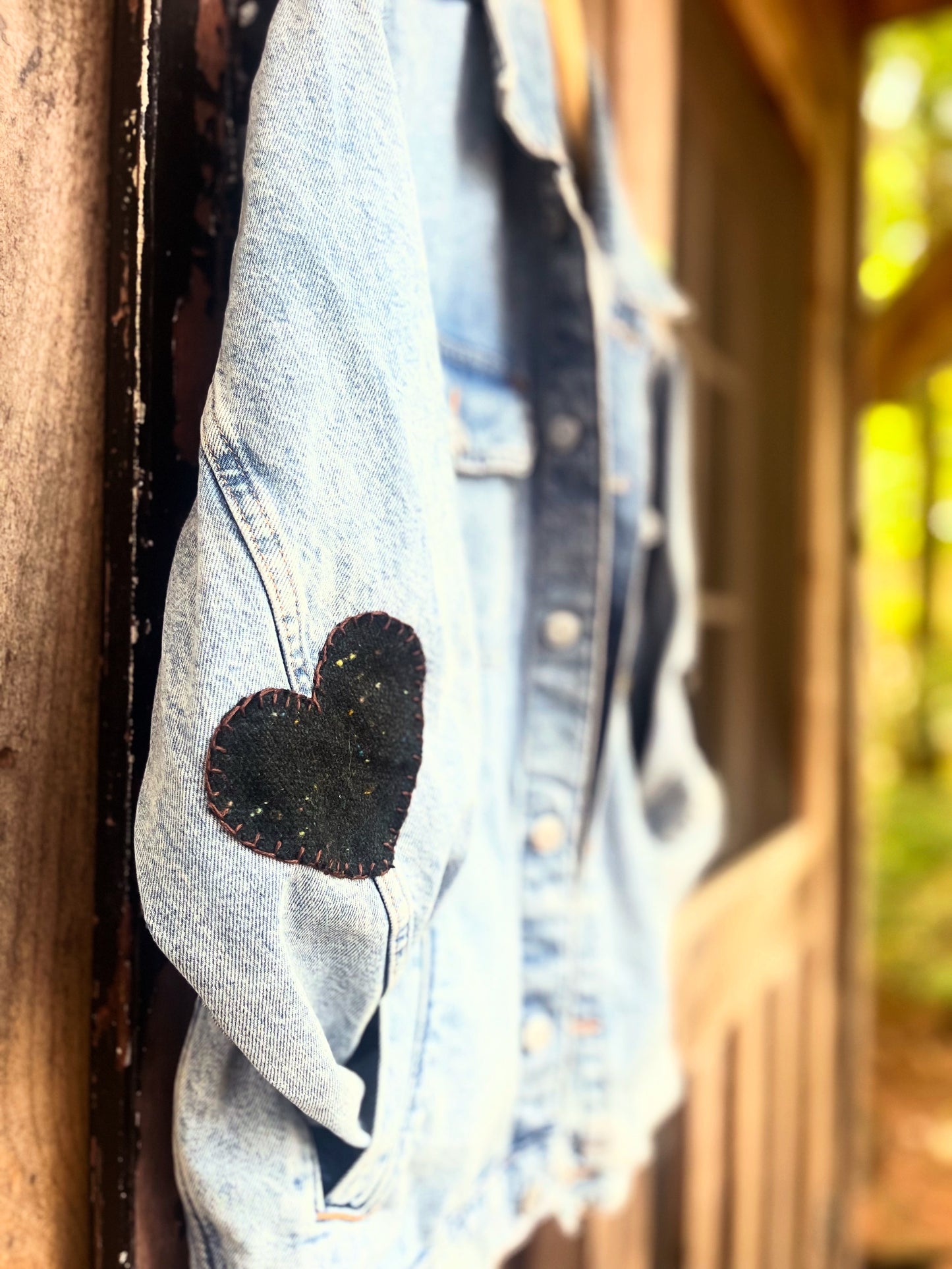 L O V E denim jacket with wool heart sleeves SIZE small (assuming men’s small)