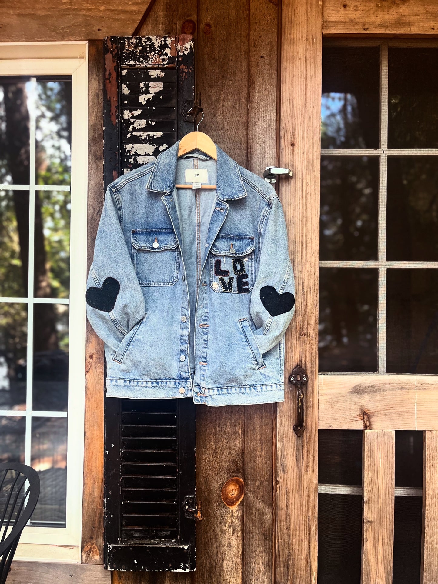 L O V E denim jacket with wool heart sleeves SIZE small (assuming men’s small)
