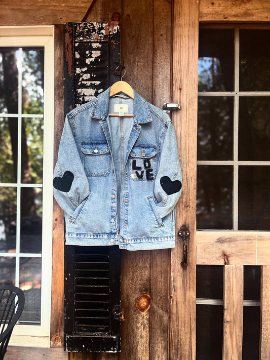 L O V E denim jacket with wool heart sleeves SIZE small (assuming men’s small)
