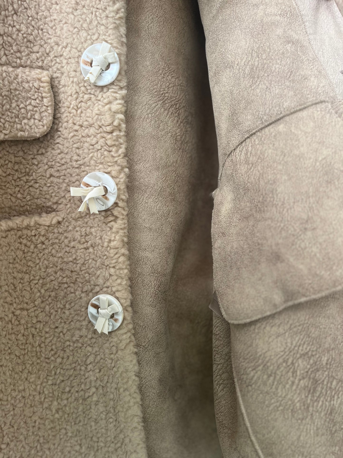 The JACKET. 100% lamb shearling in SIZE small with leather tie buttons. RARE!